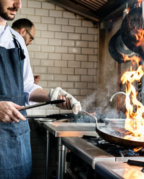 Men cooking on a frying pan